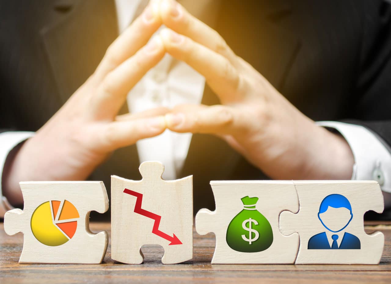 Businessperson with puzzle pieces representing financial uncertainty and investment decisions.