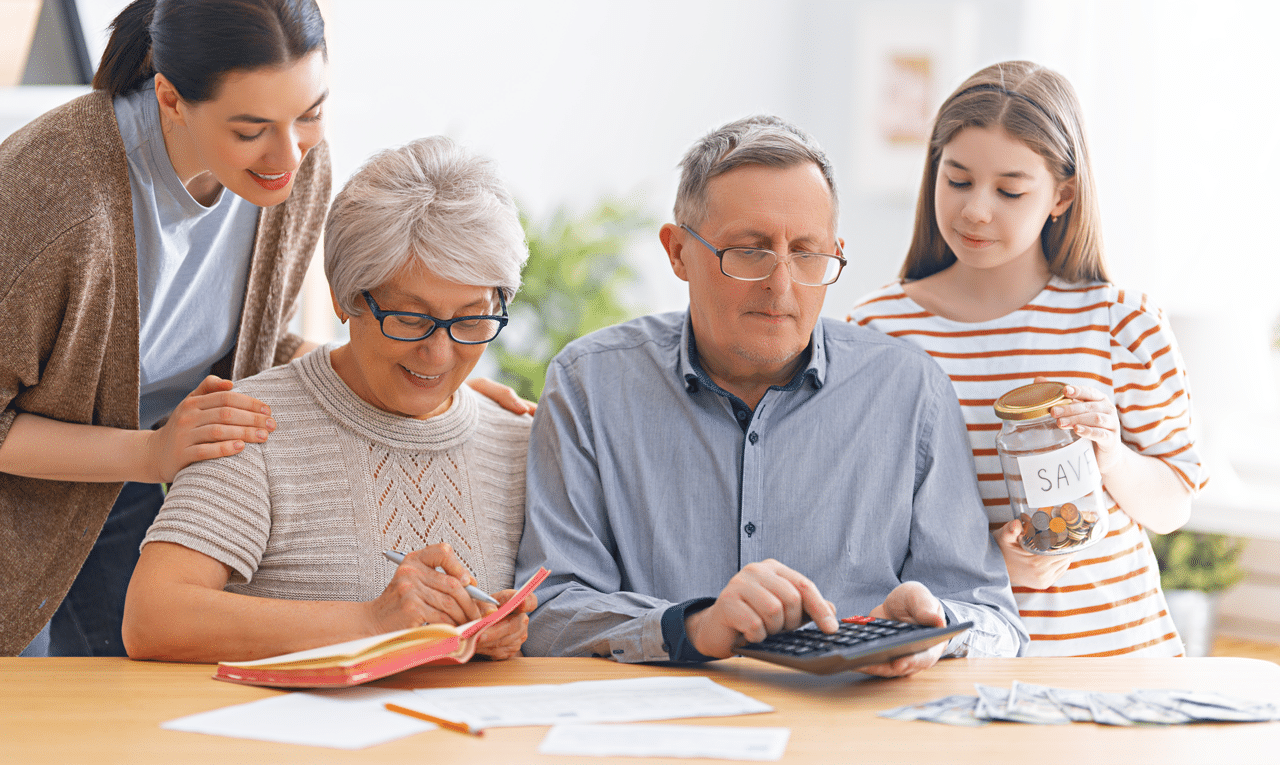 Family sitting together discussing budgeting and planning, representing Financial Conversations with Adult Children.
