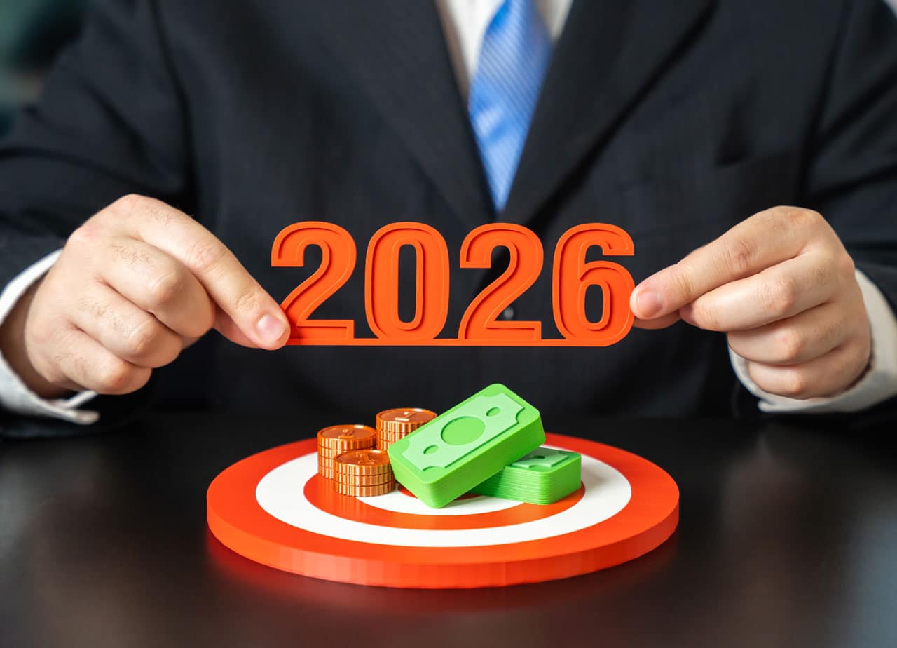 Financial planning concept showing a professional holding the year 2026 above a target with money, representing long-term financial planning, evolving goals, and strategic wealth management.